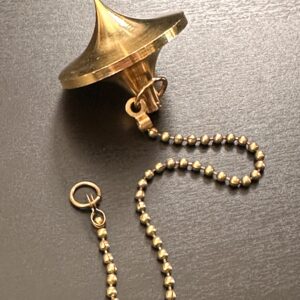 Pendule Toupie laiton doré